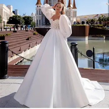 Kāzu Kleita Luxury Ir 2021. Balts Elegants Satīna Balles Kleitas Mīļotā Ilgi Puff Piedurknēm Ar Mežģīņu Appliques Royal Vilcienu Princese Gracefu